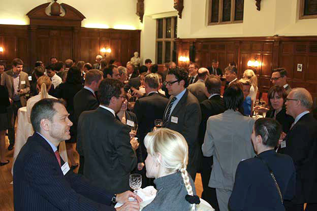 Picture of people enjoying a champaign reception.